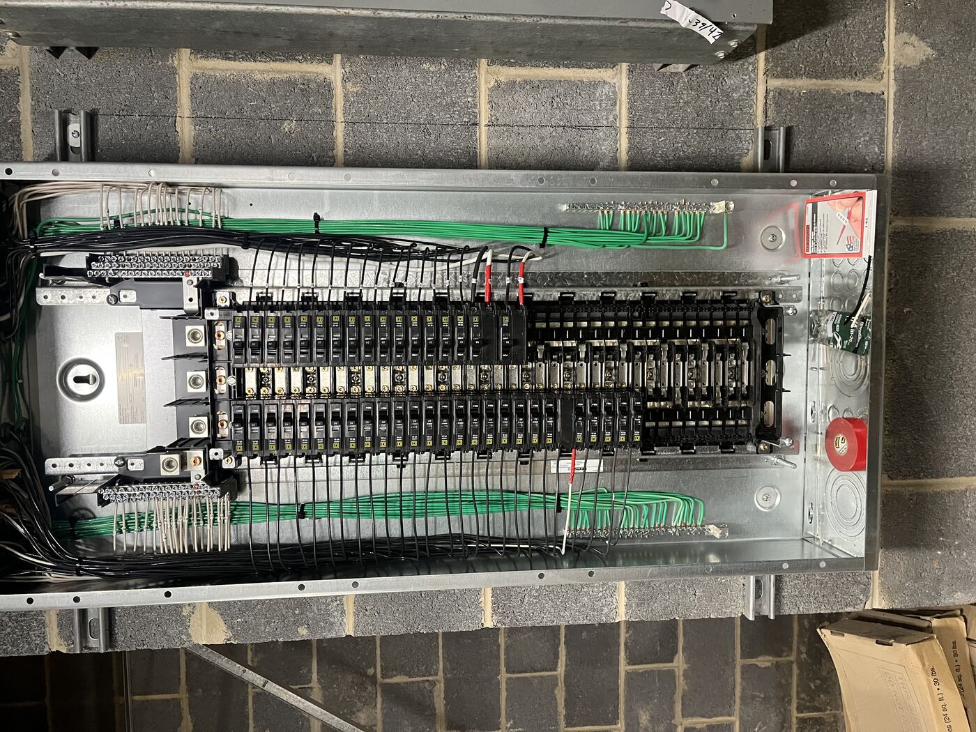 Commercial three-phase panel with organized branch circuits and dedicated grounding