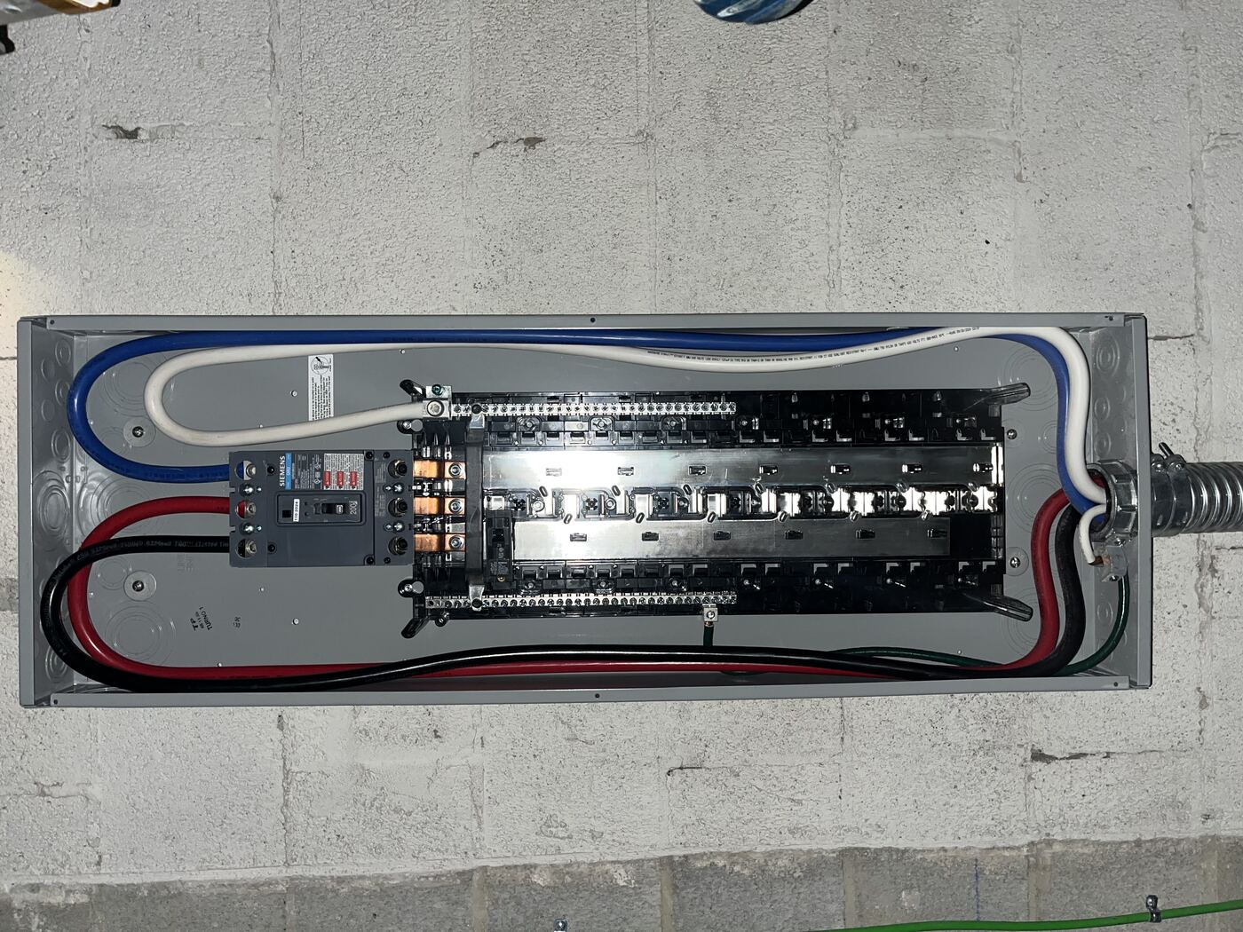 New Siemens 200A main breaker panel with clean feeder conductors